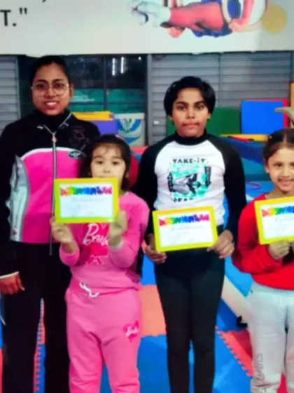 This group of girls and their coach are all smiles after a successful certification day.