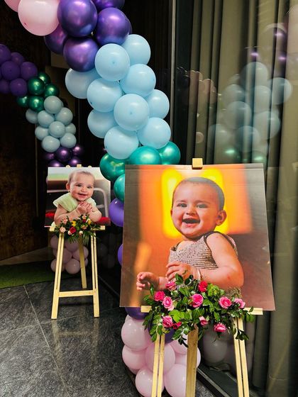 A close-up of the personalized photo displays at the party entrance. These easels are a sweet and personal way to celebrate the birthday girl and make for a great photo opportunity.