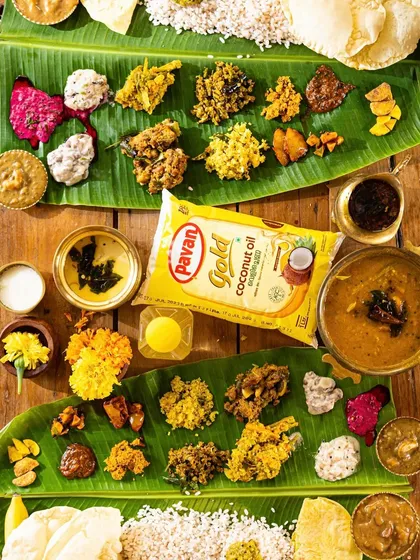 A classic Onam sadhya spread on a banana leaf. This top-down shot captures the variety and richness of the feast, a key element in festive food photography.