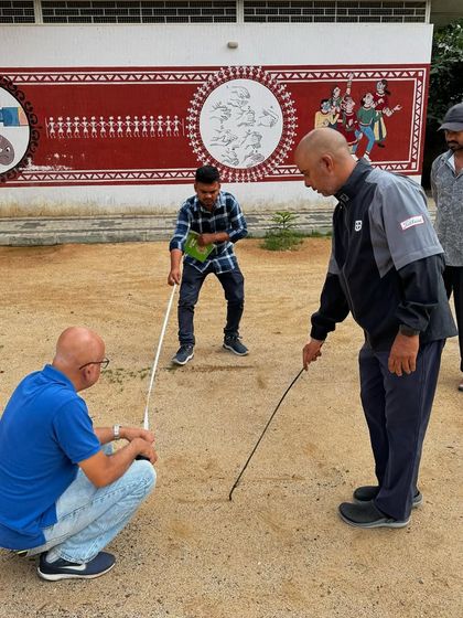 Measuring out the space for hitting bays and a short game area. This grassroots work is essential for sourcing new talent and making golf accessible.