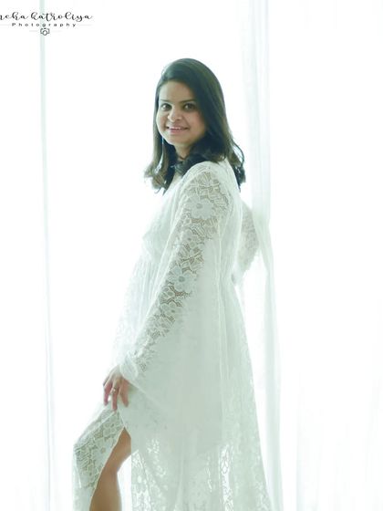 A simple and beautiful portrait against a bright window. The high-key lighting creates a fresh and timeless feel.