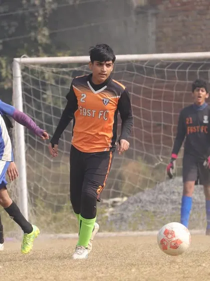 A player on the ball, looking for a pass during a Winter Cup game.