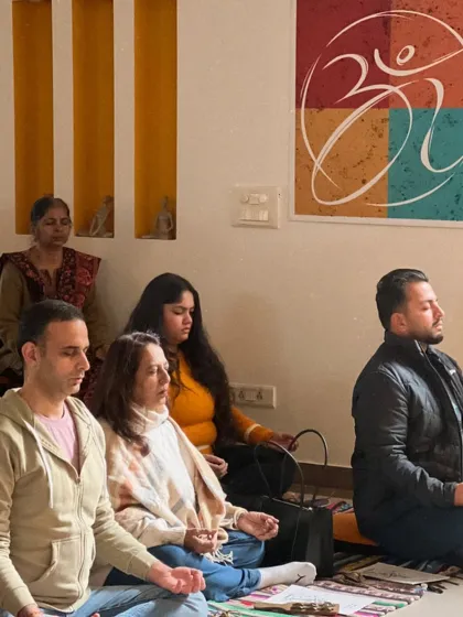 A group meditates together, finding stillness amidst the transition to a new year. This is a powerful way to let go of the old and welcome the new.