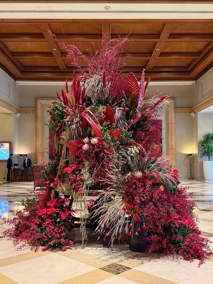 The complete Christmas lobby installation, a grand statement of festive cheer. It is designed to be a showstopper, drawing guests in and filling the space with the magic of the season.