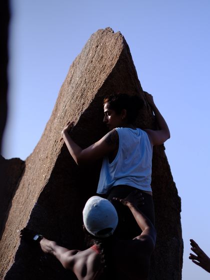 A beautiful shot of a climber on the iconic Left Arete boulder on Rishimuk Plateau in Hampi. This photo captures the focus and strength it takes to tackle such a classic climb.