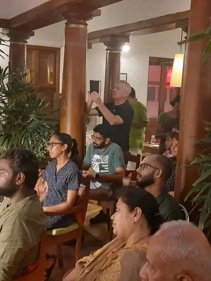 A side view of the audience enjoying our show. We love performing in spaces that allow for a close connection with the viewers.