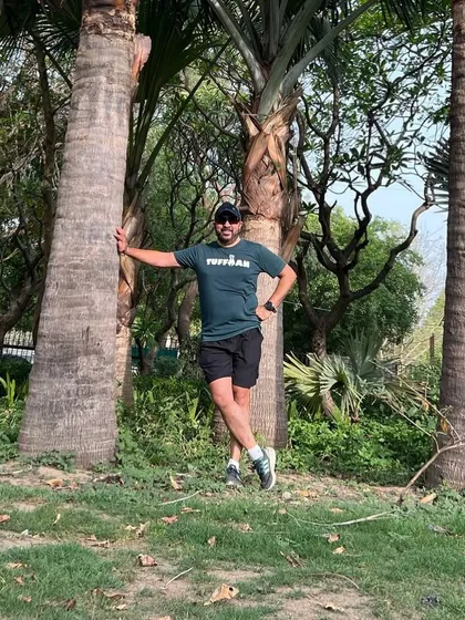 A member enjoying a moment of peace in nature after a group run. Our runs are a great way to connect with both people and the outdoors.
