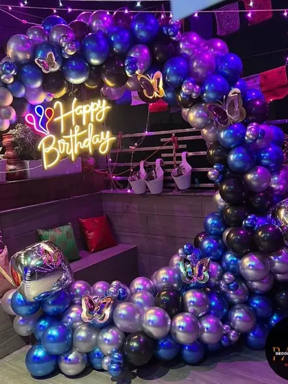 Another shot of the terrace butterfly ring decoration, showing the shimmering chrome balloons under the party lights.