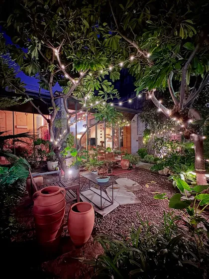 The completed courtyard of our studio at night. Well-designed landscapes are not just for the day; they transform into magical spaces for gathering and reflection after sunset, blurring the lines between a building and its natural surroundings.