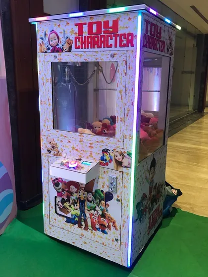 Our 'Toy Character' claw machine is always a highlight, giving guests the chance to win a stuffed toy. We can stock it with prizes to match your party's theme, making it a perfect addition to birthdays and family events.