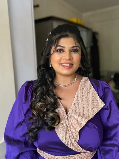 A smiling portrait of the client, looking confident and ready to party.