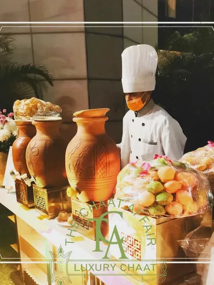 A rustic yet luxurious setup featuring earthen pots for serving. This display is perfect for events like a Guruji satsang or a traditional wedding, where we serve the highest quality dishes with reverence and style.