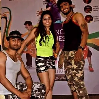 Posing with fellow instructors after a successful event. We often collaborate to bring the best energy to the stage.