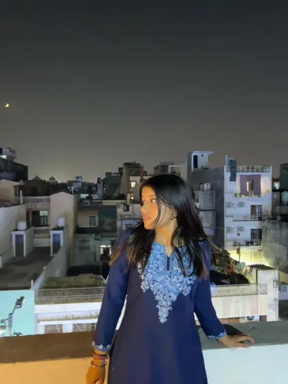 A quiet moment on a rooftop, looking at the moon. The night sky often finds its way into the lyrics of my songs about love and distance.