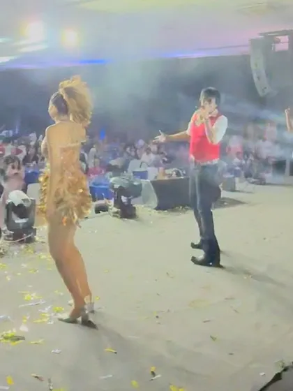 A wide shot of the stage during a performance, showing the scale and the audience in the background.