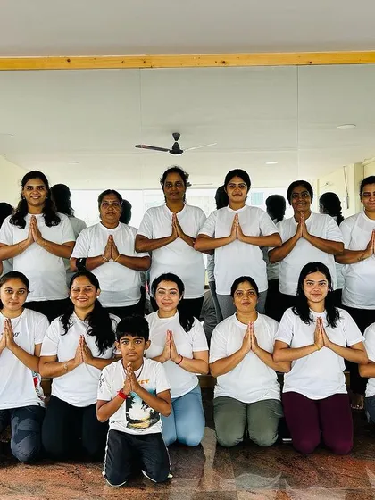 Our yoga family gathered to celebrate International Yoga Day. We are united in our practice and our commitment to wellness, with hands joined in a collective 'Namaste'.