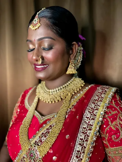 A close-up of the eye makeup, a shimmery gold that makes her eyes sparkle.