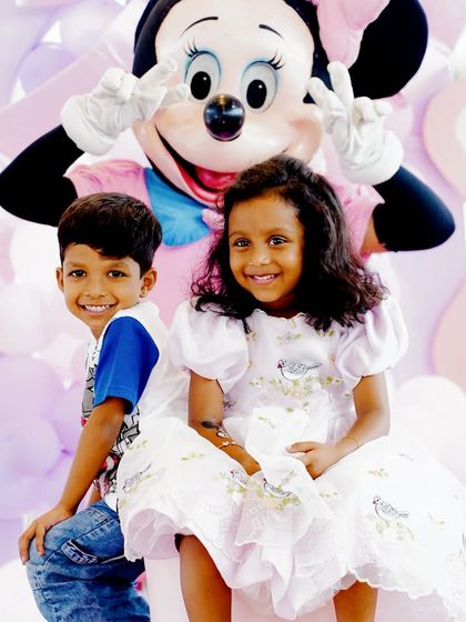 A heartwarming photo of two young guests posing with the Minnie Mouse mascot. We can arrange for character appearances to make the party extra special.