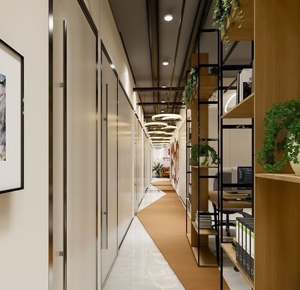 This is the main lobby and corridor in the IT office. We used open shelving with greenery and clean lines to create a pathway that feels open and connects the different zones of the office.