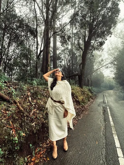 A solo shot of me enjoying the misty, beautiful roads of Ooty. This photo captures a moment of peace and happiness amidst a family trip, showing that my content also includes personal, reflective moments.