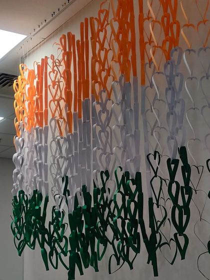 A close up view of the hanging paper heart flag, showing the texture and detail of the craft.