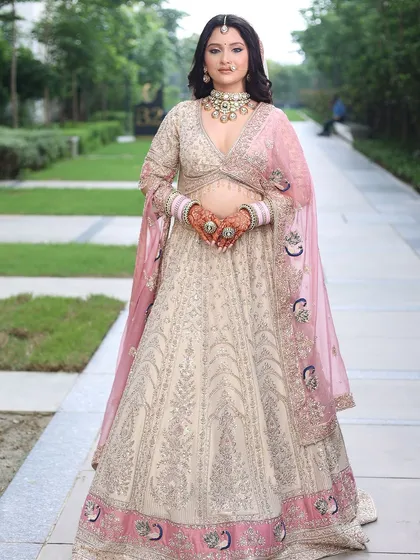 A full-length shot of the pastel bridal lehenga, perfect for a modern bride. The A-line skirt and the V-neck blouse create a flattering silhouette.