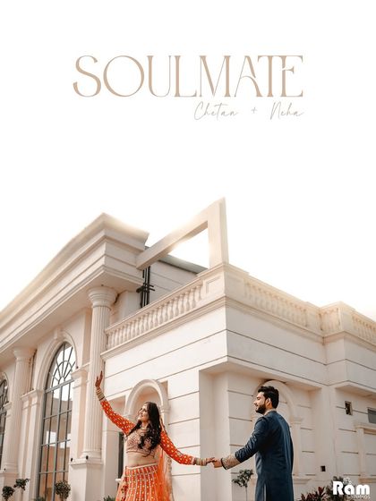 A grand, celebratory shot of the couple outside a beautiful, modern venue. The bride's joyful pose and the "Soulmate" title make this a perfect announcement-style photograph.