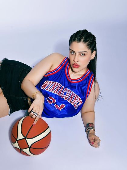 This was a shoot for a women's fitness publication, featuring a bold, athletic theme. I styled this shot with a basketball jersey and a basketball to create a sporty, confident look that breaks away from traditional beauty imagery.