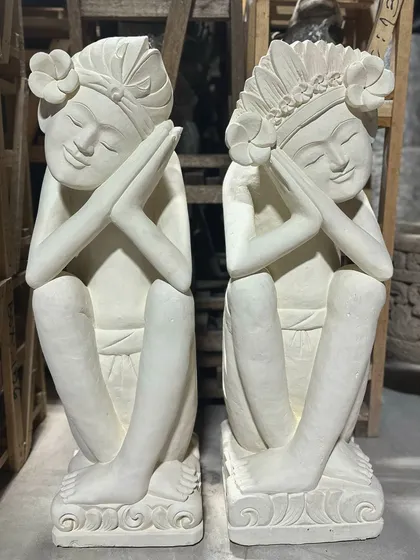 A pair of our serene sandstone dolls. With their peaceful expressions and hands held in prayer, they are a beautiful representation of Balinese grace and tranquility.