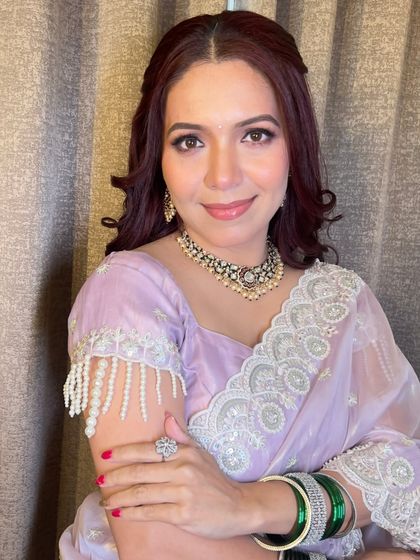 Another angle of the reception look, highlighting the beautiful pearl detailing on her blouse and her elegant jewellery.