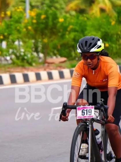 A female cyclist powers through the course. Our women's category is growing stronger every year, with incredible athletes pushing the boundaries.