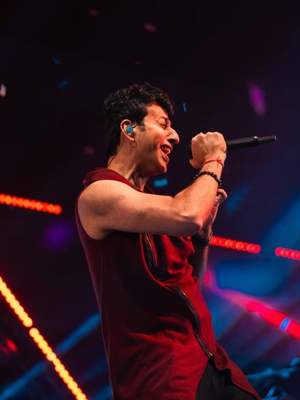 Salim Merchant in the midst of a powerful vocal performance. We ensure crystal-clear audio so every note is heard perfectly by the audience.