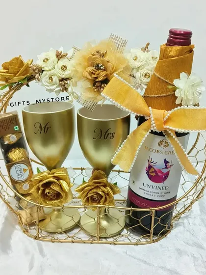 The perfect gift for a friend who is getting married soon! This elegant basket includes wine, Mr. & Mrs. glasses, and chocolates.