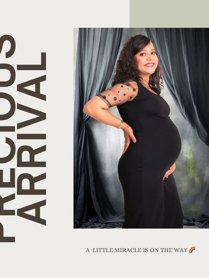 A simple and elegant portrait against a draped studio backdrop. This style is perfect for creating a timeless image that feels both professional and warm.