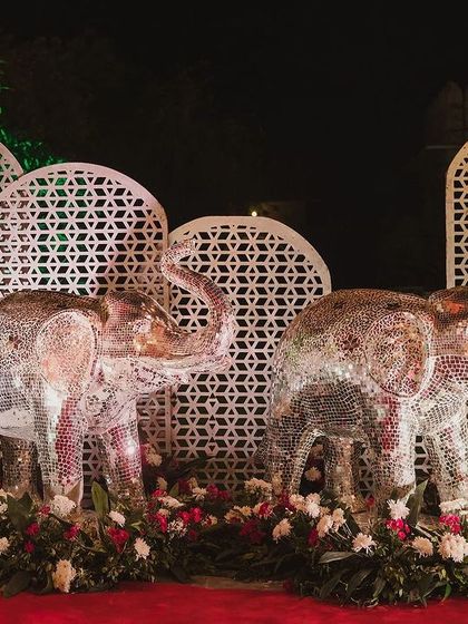 For a regal wedding entrance, we used these magnificent life-sized elephants made of intricate thikri mirror work. They stood as grand, sparkling sentinels, welcoming guests to the celebration.