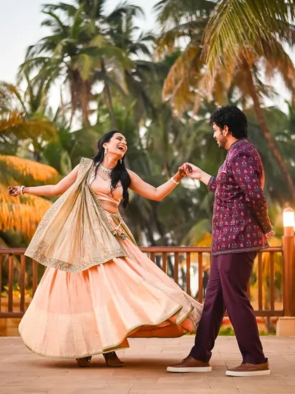A dance, a twirl, a moment of pure joy. Soha and Revant's playful energy is infectious against the warm, tropical backdrop.