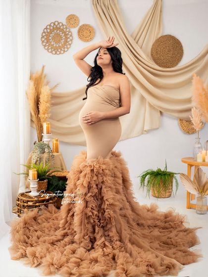 A powerful and glamorous pose in the ruffled gown, set within the warm and textural boho studio.