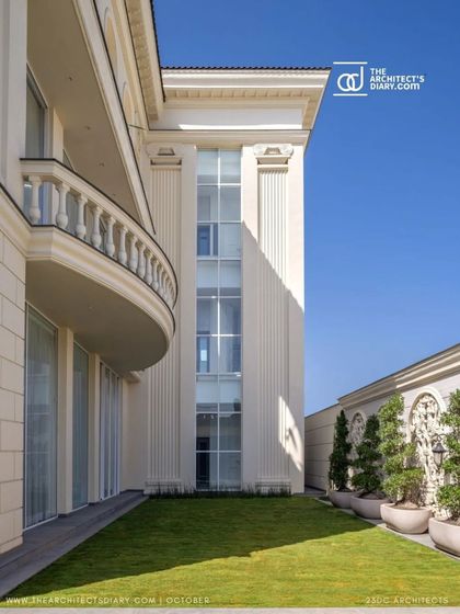 The side elevation of The Ivory Royale showcases its clean lines, classical balcony, and manicured lawn. The design maintains its regal character from every angle, with careful attention to proportion and detail.