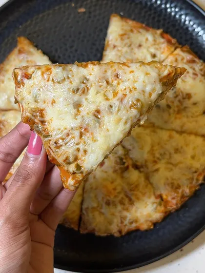 A slice of my Melting Cheese Pizza, showing the perfectly melted cheese and crispy crust.