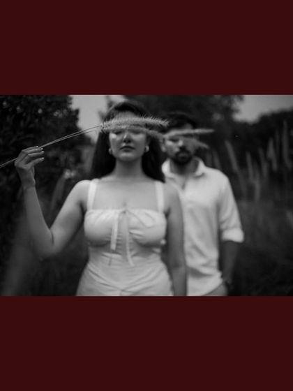 An artistic black and white portrait with a creative focus effect, adding a dreamy and mysterious quality to the image.