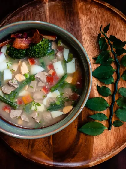My special Paaya soup is slow-cooked overnight to create a rich, gelatinous bone broth. I load it with fresh vegetables, tender meat, and liver, making it an incredibly nutritious and comforting meal, especially for older dogs or those needing extra hydration.