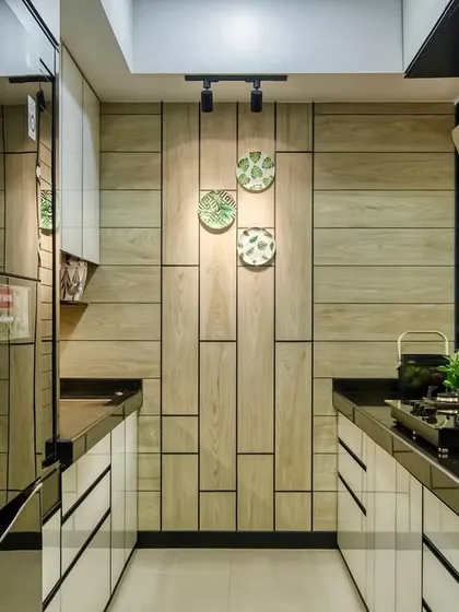 Another angle of the Lodha Park kitchen, showing the beautiful interplay of wood, glass, and light.