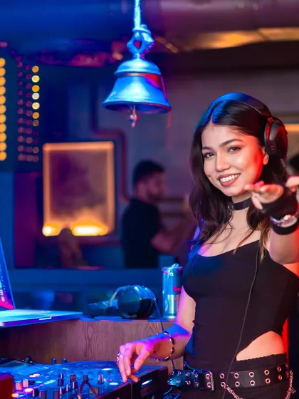 My goal is to connect with every person on the dance floor. This shot captures me interacting with the crowd, inviting everyone to join the party and feel the music.