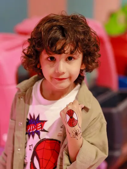 A close-up of the cool Spider-Man tattoo art. We offer fun add-ons like temporary tattoos and face painting to help kids get even more into the party theme.