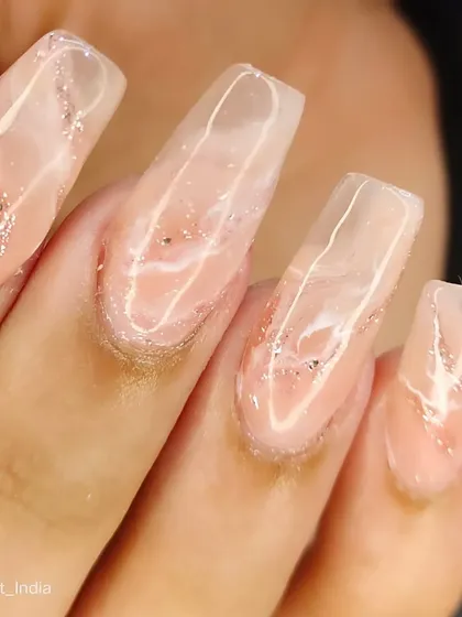 A throwback to this acrylic extension work from 2022. A beautiful clear nail with a pink marble effect.