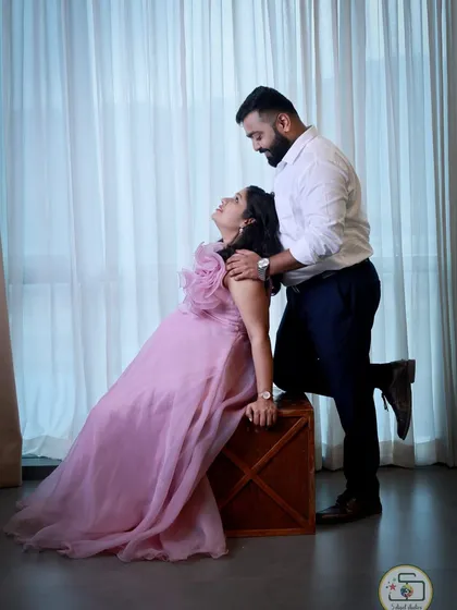 Our lavender organza gown is pure romance. It features a large, handcrafted statement flower on the shoulder and a light, airy skirt that flows beautifully.