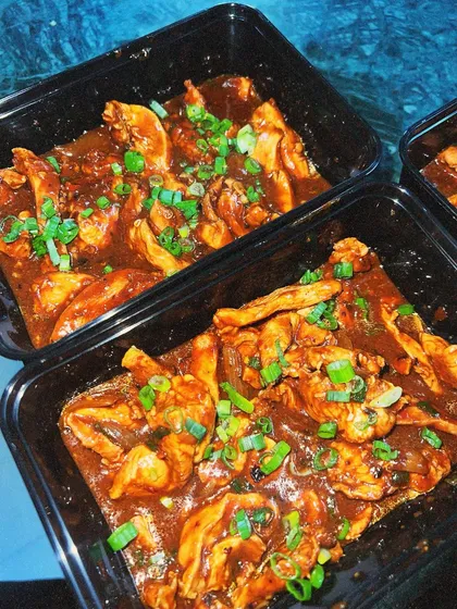 Our flavourful chili chicken, packed in delivery containers. We make our sauces from scratch to ensure that rich, authentic taste.