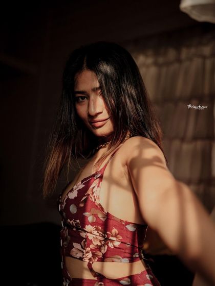 A slightly different angle from the same series, showing how a small change in pose can alter the mood of the portrait.