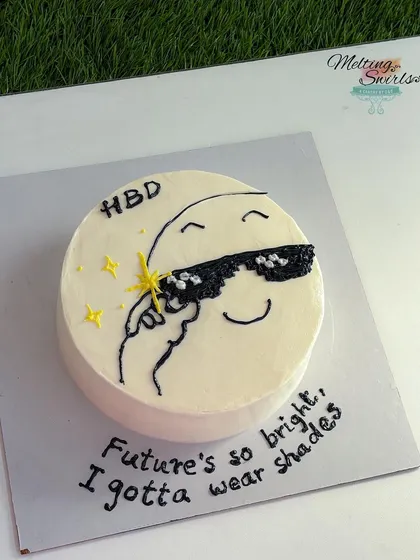"Future's so bright, I gotta wear shades." The second of the twin cakes, this one features a cool, hand-drawn character on a minimalist buttercream base.