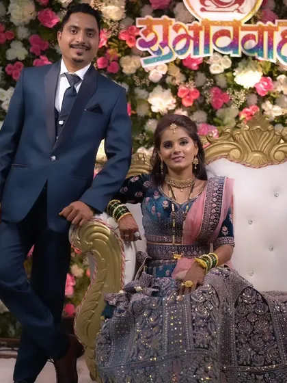 A beautiful portrait of the bride and groom, showcasing their coordinated reception outfits.